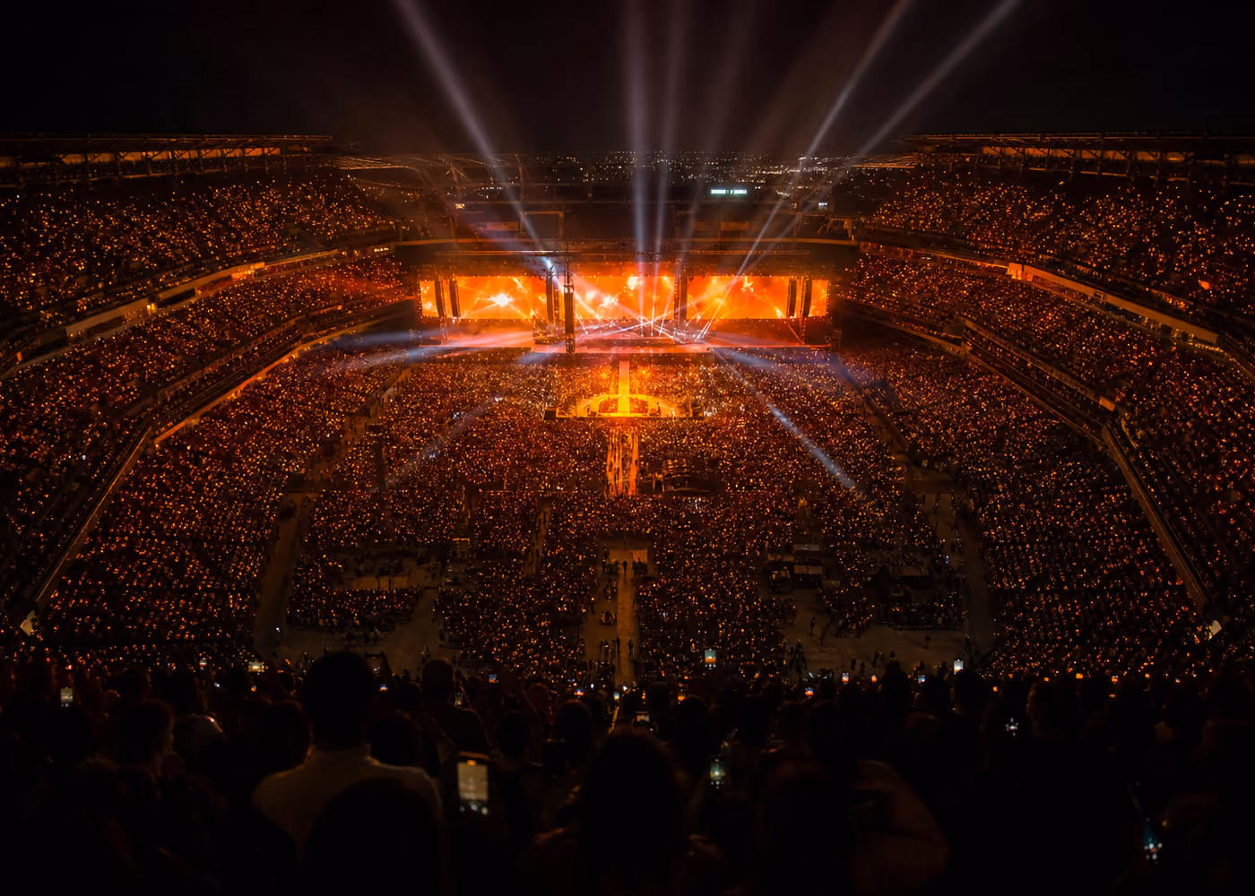 A concert crowd inside a stadium